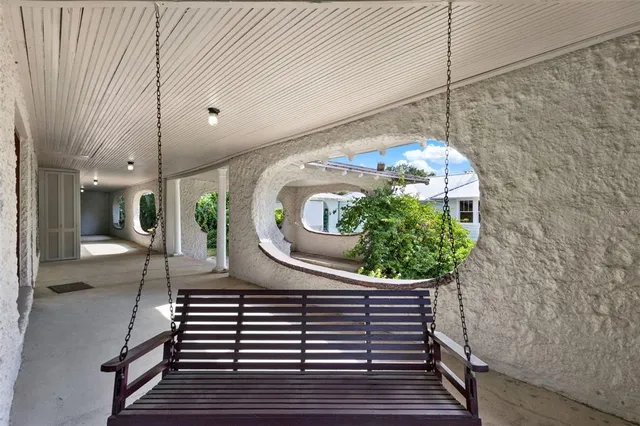 a view of a balcony with furniture
