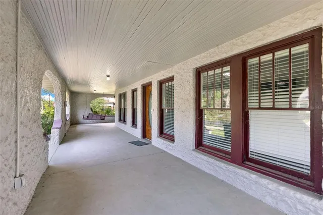a view of a room with large windows