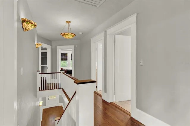 a view of an entryway with wooden floor