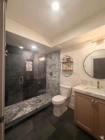 3626 Riverstone Road Mapleton, UT 84664 - Photo 47 of 58 Full bath featuring vanity, a shower stall, and dark tile patterned flooring