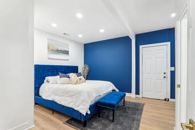 a bedroom with a bed and a table