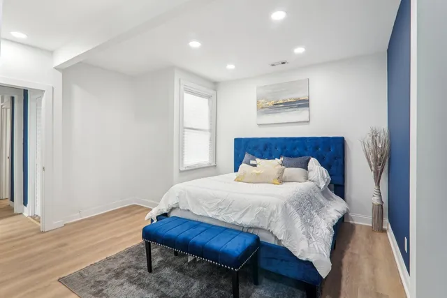 a bedroom with a bed and a window