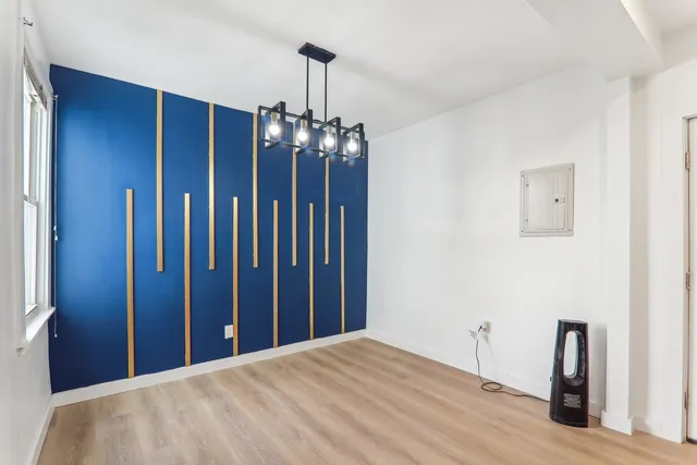 a view of a hallway with chandelier