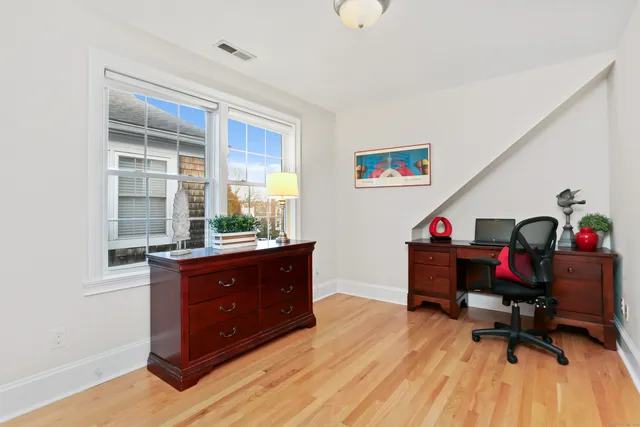 a room with a desk and a workspace