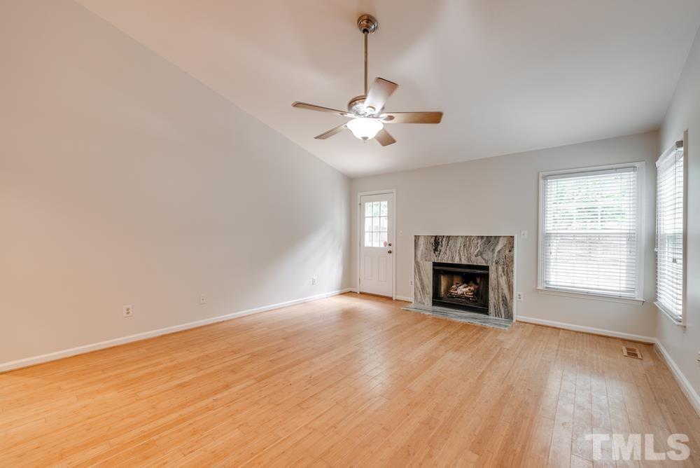2349 Florida Court Raleigh, NC 27615 - Photo 8 of 19 a view of empty room with a fireplace and fan