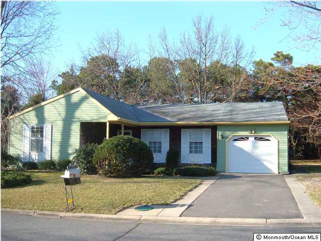 52 Sunset Road Whiting, NJ 08759 - Photo 1 of 3 a front view of house with garage and yard