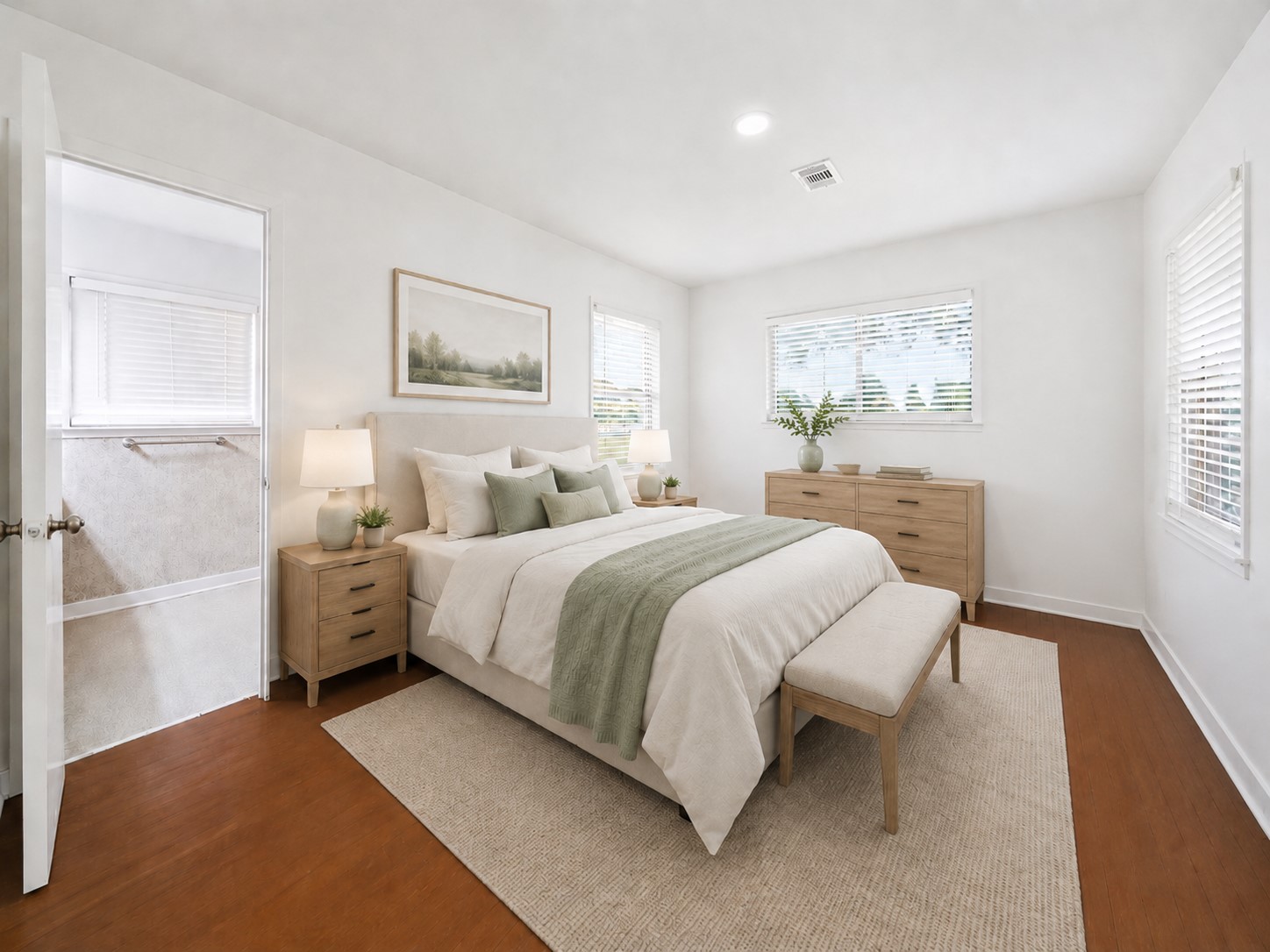 5443 Randon School Road Rosenberg, TX 77471 - Photo 12 of 20 Primary bedroom with warm wood flooring, bright white walls, recessed lighting, multiple windows, and direct access to the en suite bath.