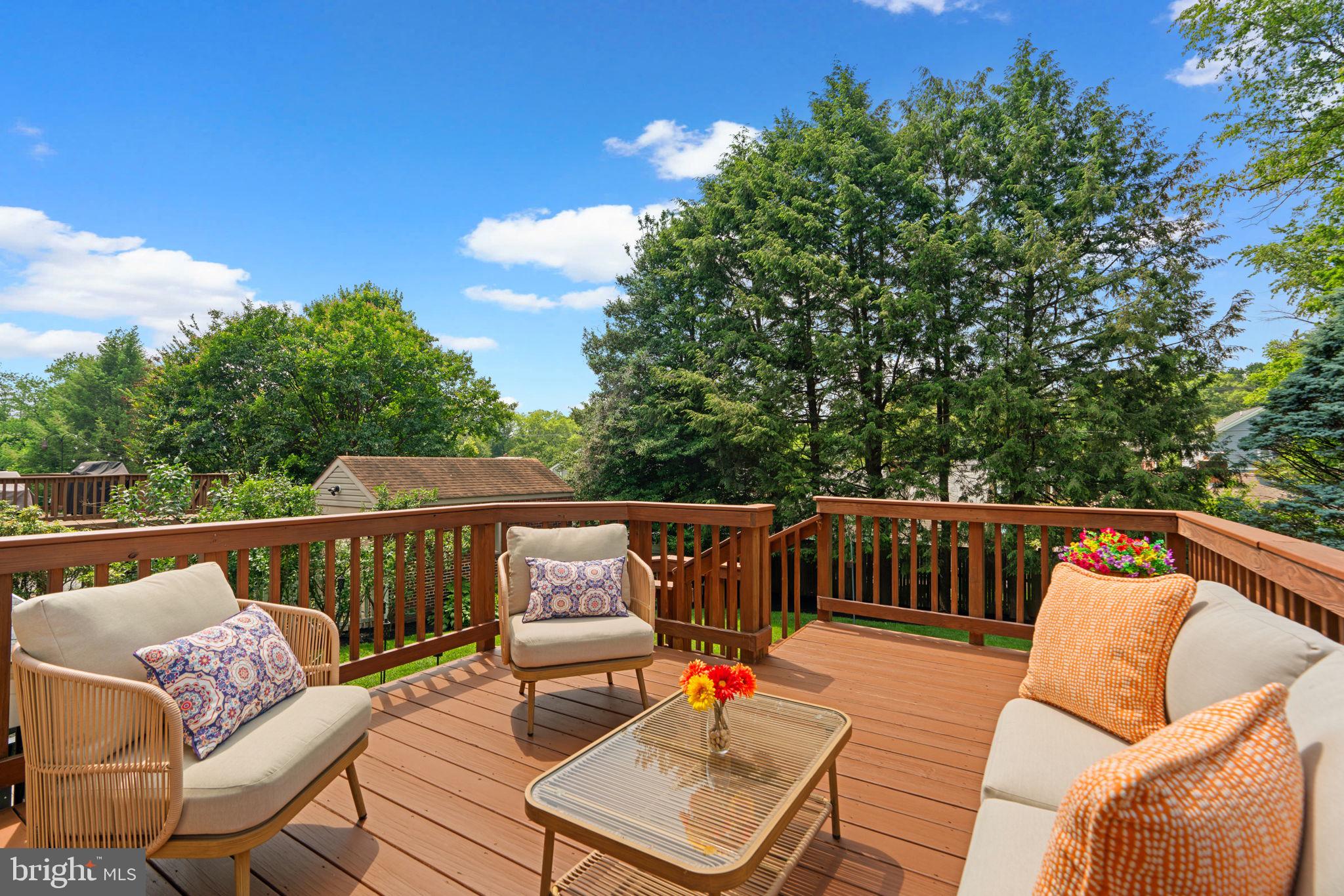9922 Rogart Road Silver Spring, MD 20901 - Photo 36 of 46 a balcony with wooden floor and outdoor seating