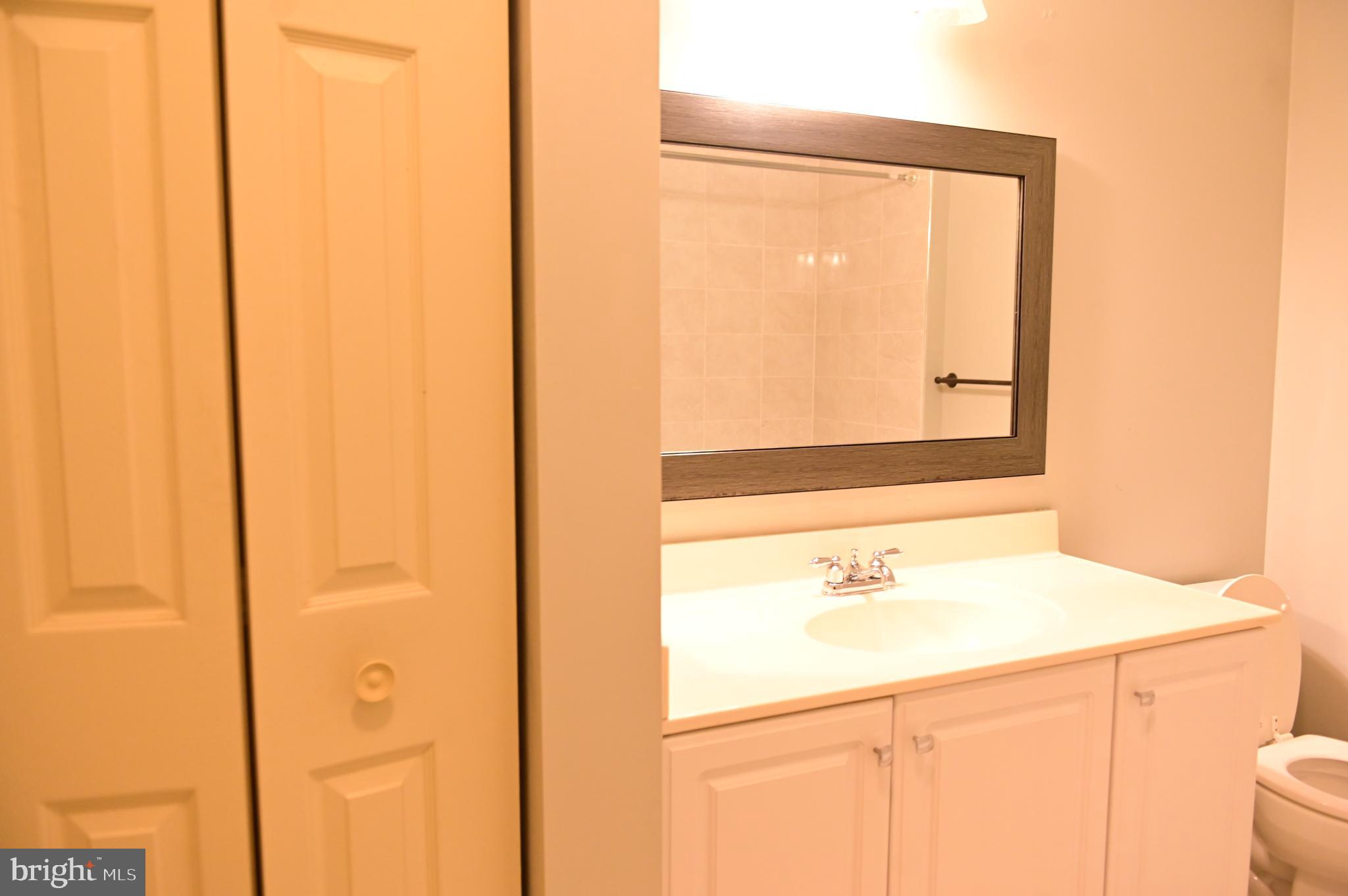 8635 Jacks Reef Road Laurel, MD 20724 - Photo 15 of 49 a bathroom with a sink and a mirror