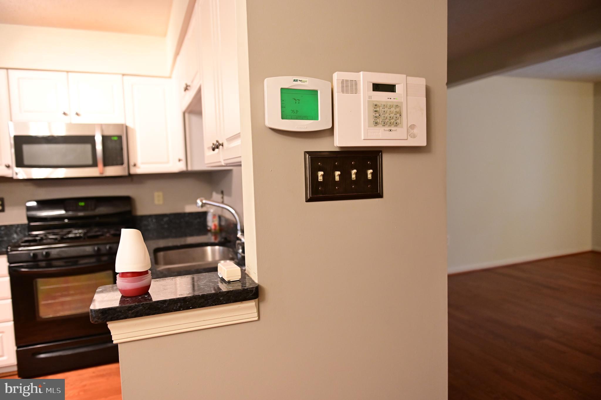 8635 Jacks Reef Road Laurel, MD 20724 - Photo 24 of 49 a kitchen with stainless steel appliances granite countertop a stove and a microwave