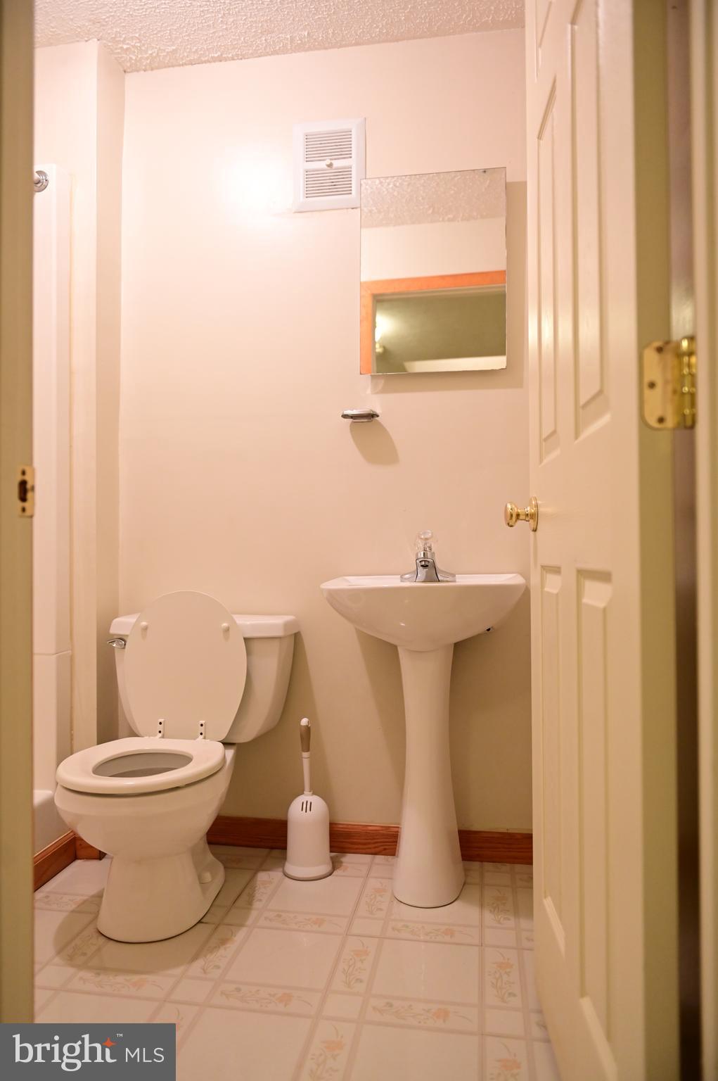 8635 Jacks Reef Road Laurel, MD 20724 - Photo 31 of 49 a bathroom with a sink and a toilet