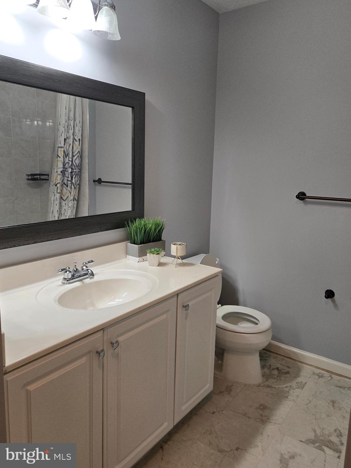 8635 Jacks Reef Road Laurel, MD 20724 - Photo 41 of 49 a bathroom with a sink and a mirror