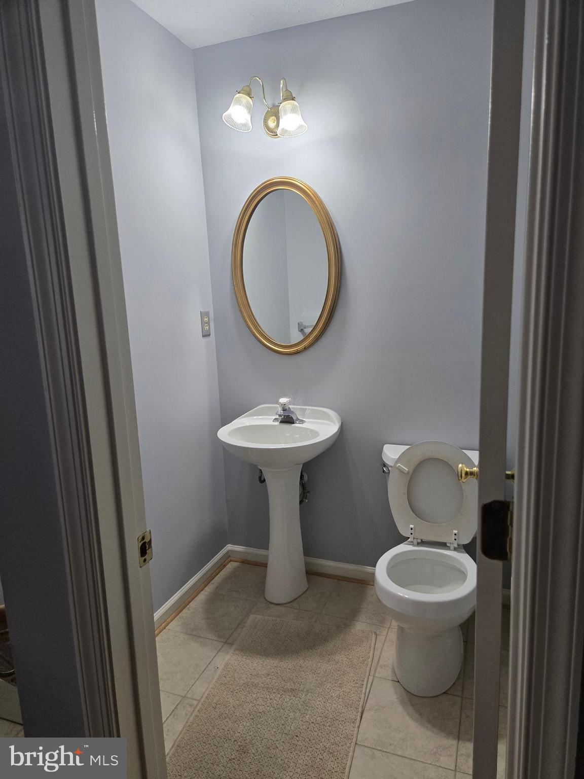 8635 Jacks Reef Road Laurel, MD 20724 - Photo 44 of 49 a bathroom with a toilet a sink and a mirror