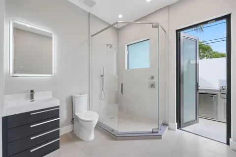 a bathroom with a bathtub and shower