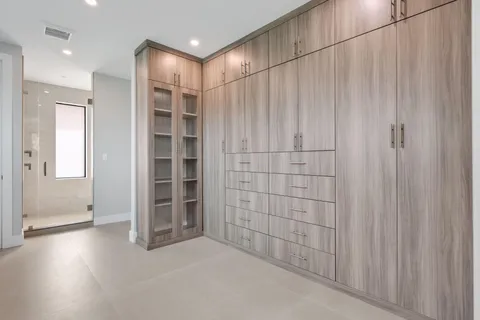 a view of backyard of house with green space