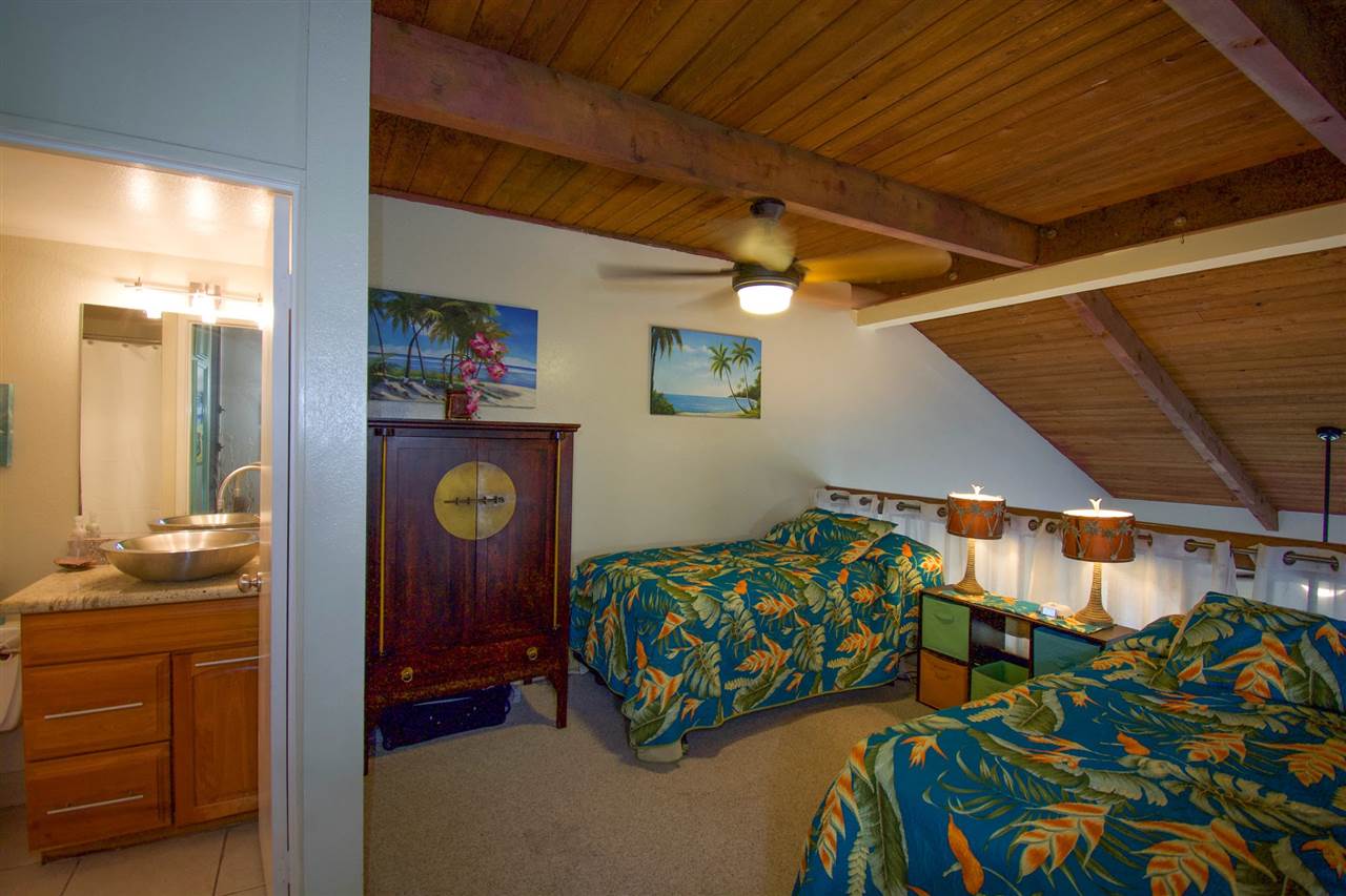 2191 South Kihei Road, Unit 3419 Kihei, HI 96753 - Photo 14 of 30 a bedroom with bed and a mirror
