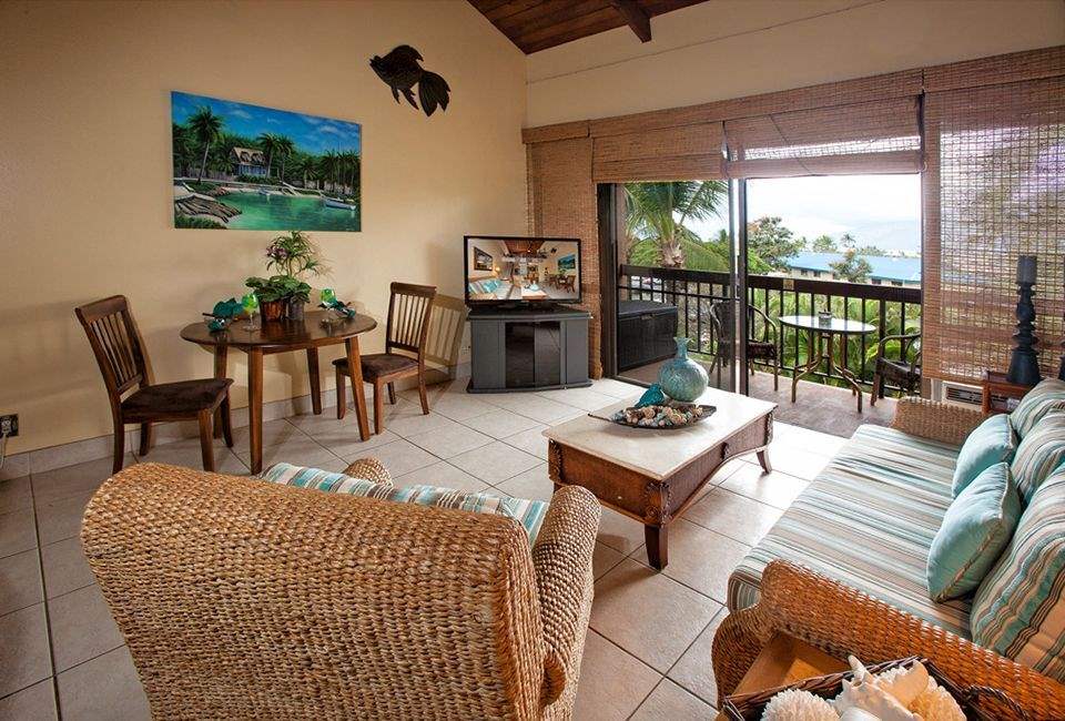 2191 South Kihei Road, Unit 3419 Kihei, HI 96753 - Photo 16 of 30 a living room with furniture a large window and a table