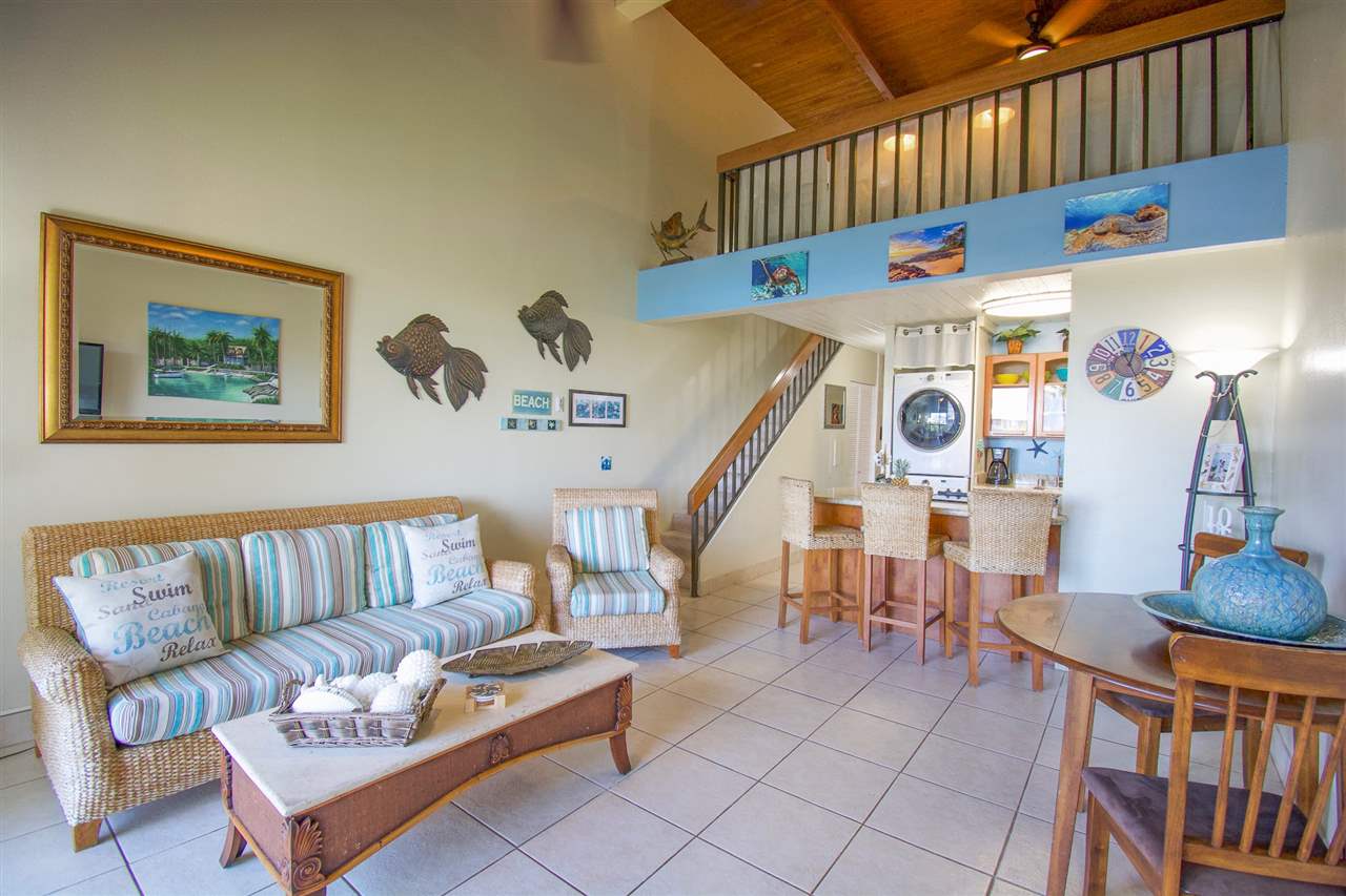 2191 South Kihei Road, Unit 3419 Kihei, HI 96753 - Photo 2 of 30 a living room with furniture and a dining table