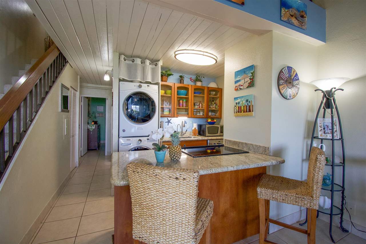2191 South Kihei Road, Unit 3419 Kihei, HI 96753 - Photo 4 of 30 a view of a dining room with furniture and a chandelier