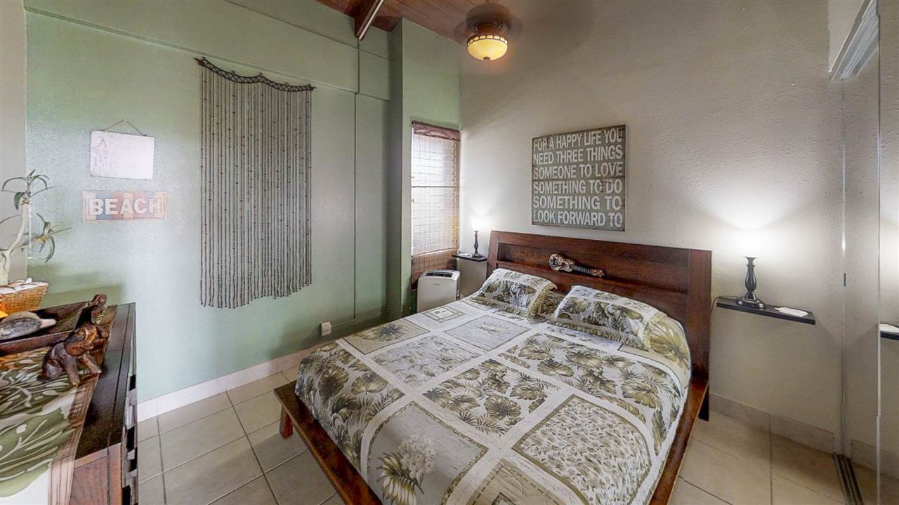 2191 South Kihei Road, Unit 3419 Kihei, HI 96753 - Photo 10 of 30 a bedroom with a bed and a window