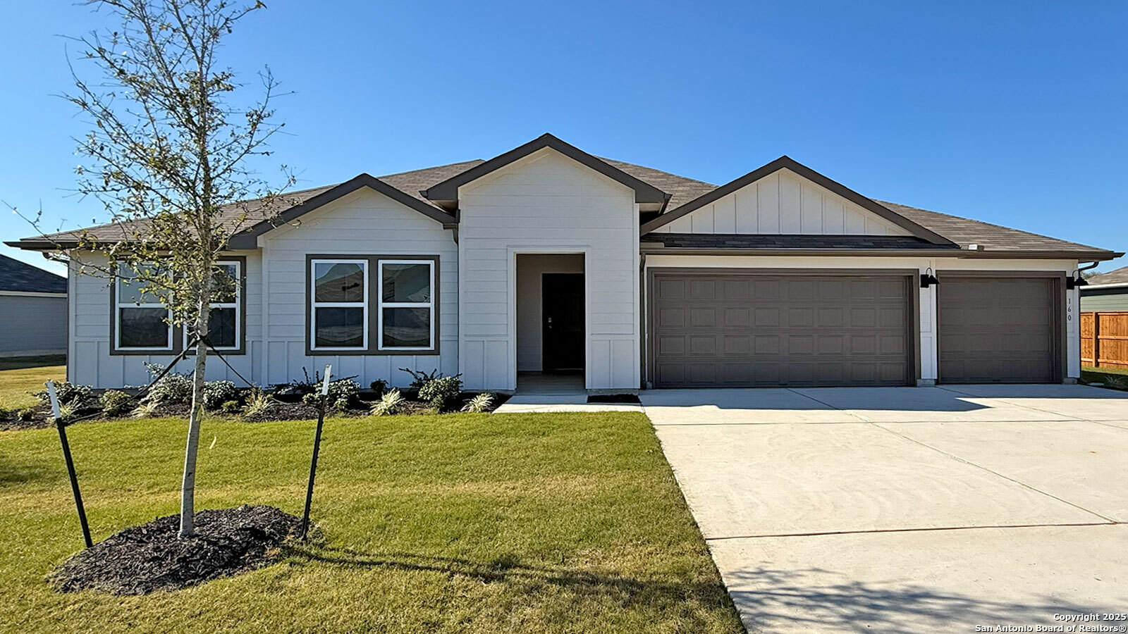 160 Kolbo Crossing Lockhart, TX 78644 - Photo 1 of 1 a front view of a house with garden