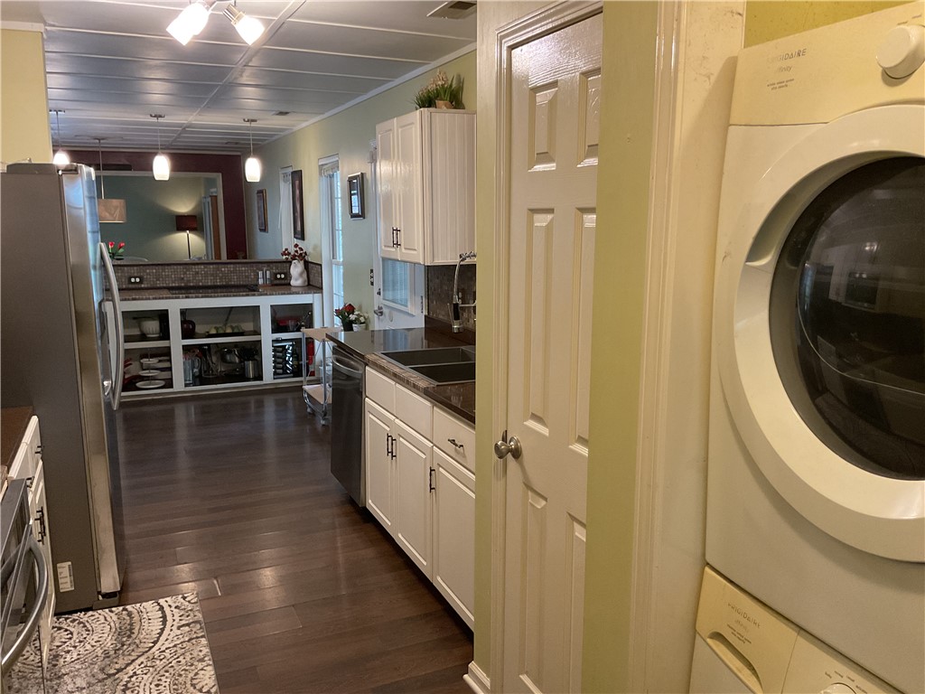 229 Cub Cove Drive Walhalla, SC 29691 - Photo 19 of 50 This bright kitchen and laundry area offer modern functionality and an inviting atmosphere.