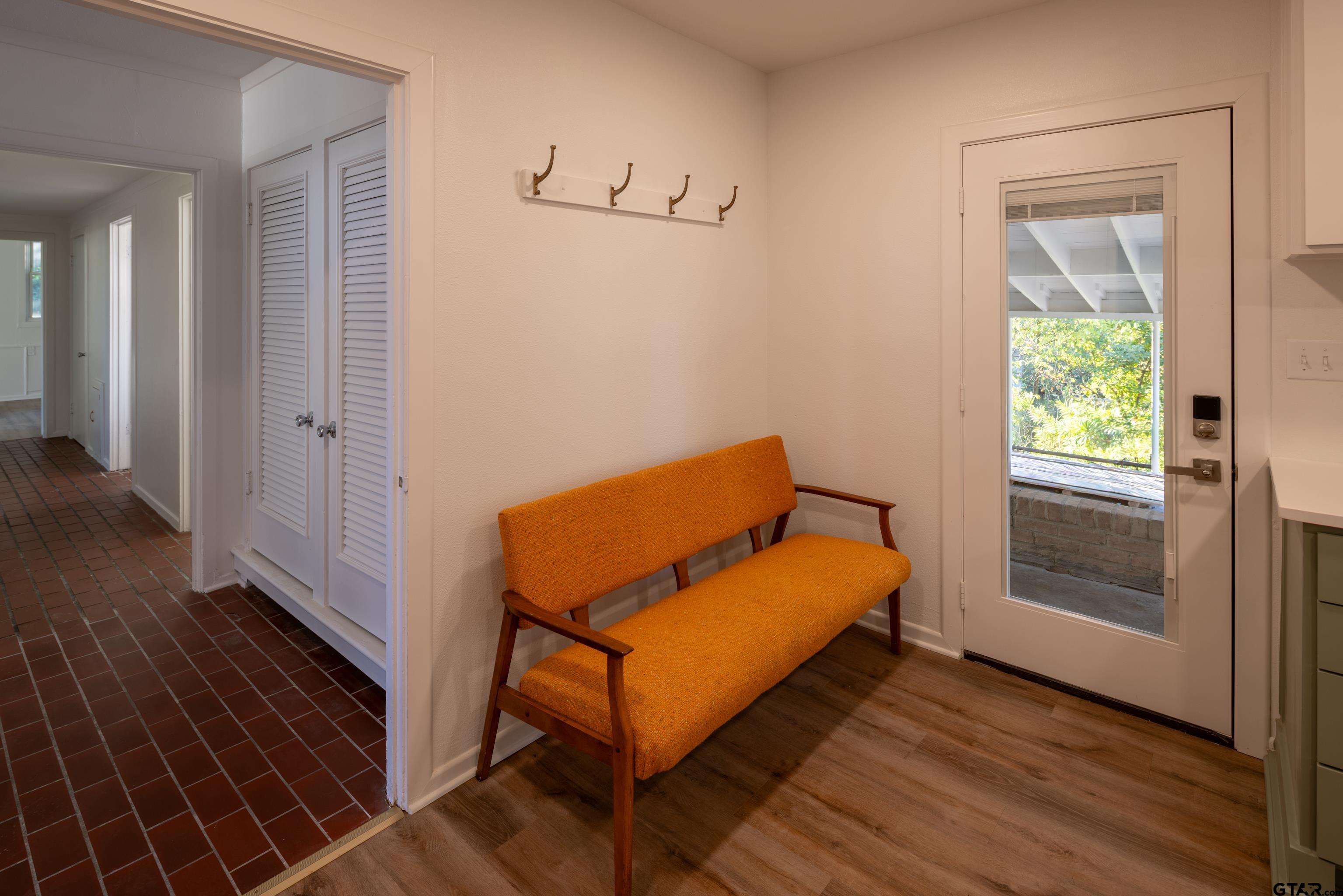 1715 Ridgeview Drive Tyler, TX 75701 - Photo 14 of 35 a room with wooden floor and a chair