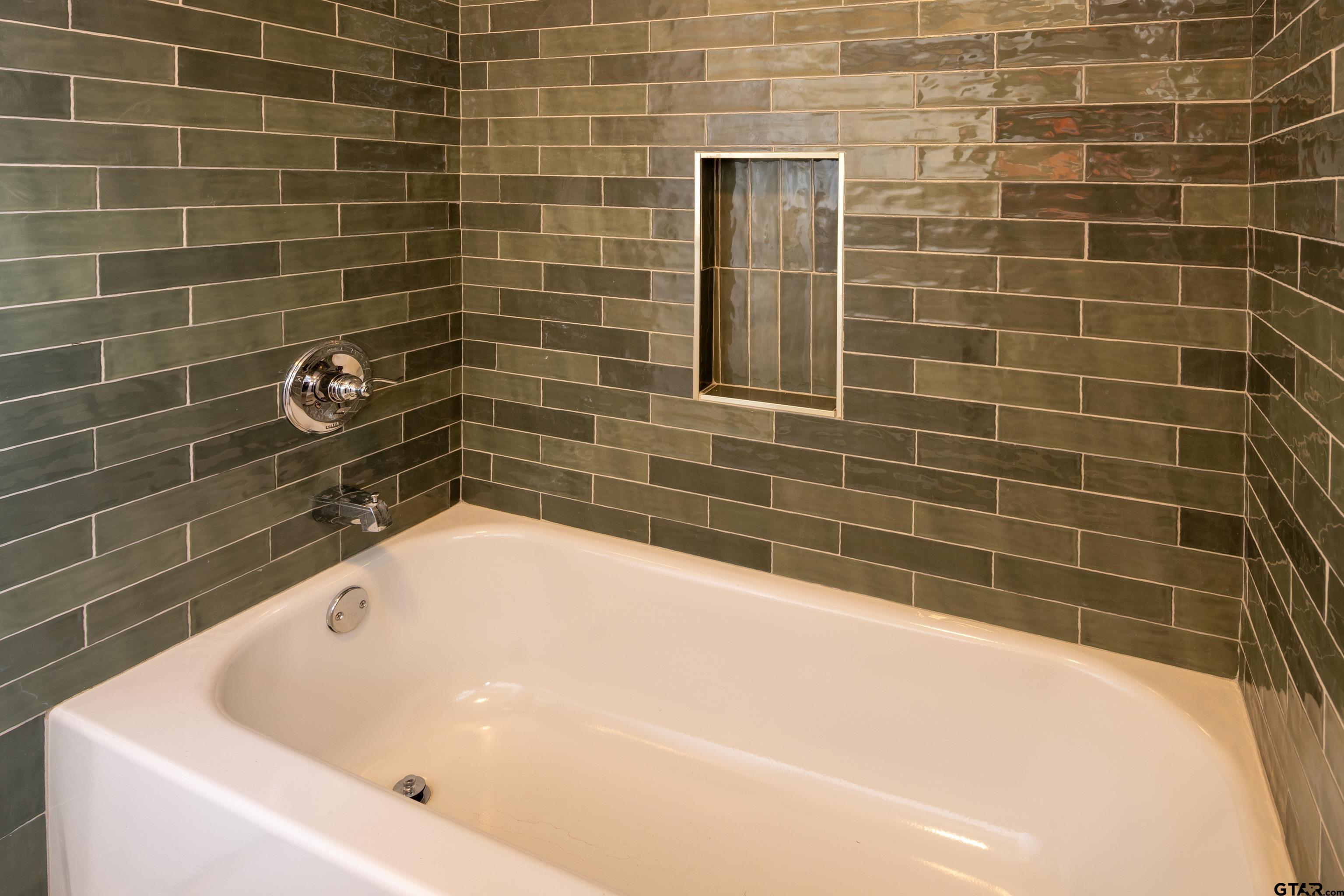 1715 Ridgeview Drive Tyler, TX 75701 - Photo 17 of 35 a bathroom with a bathtub