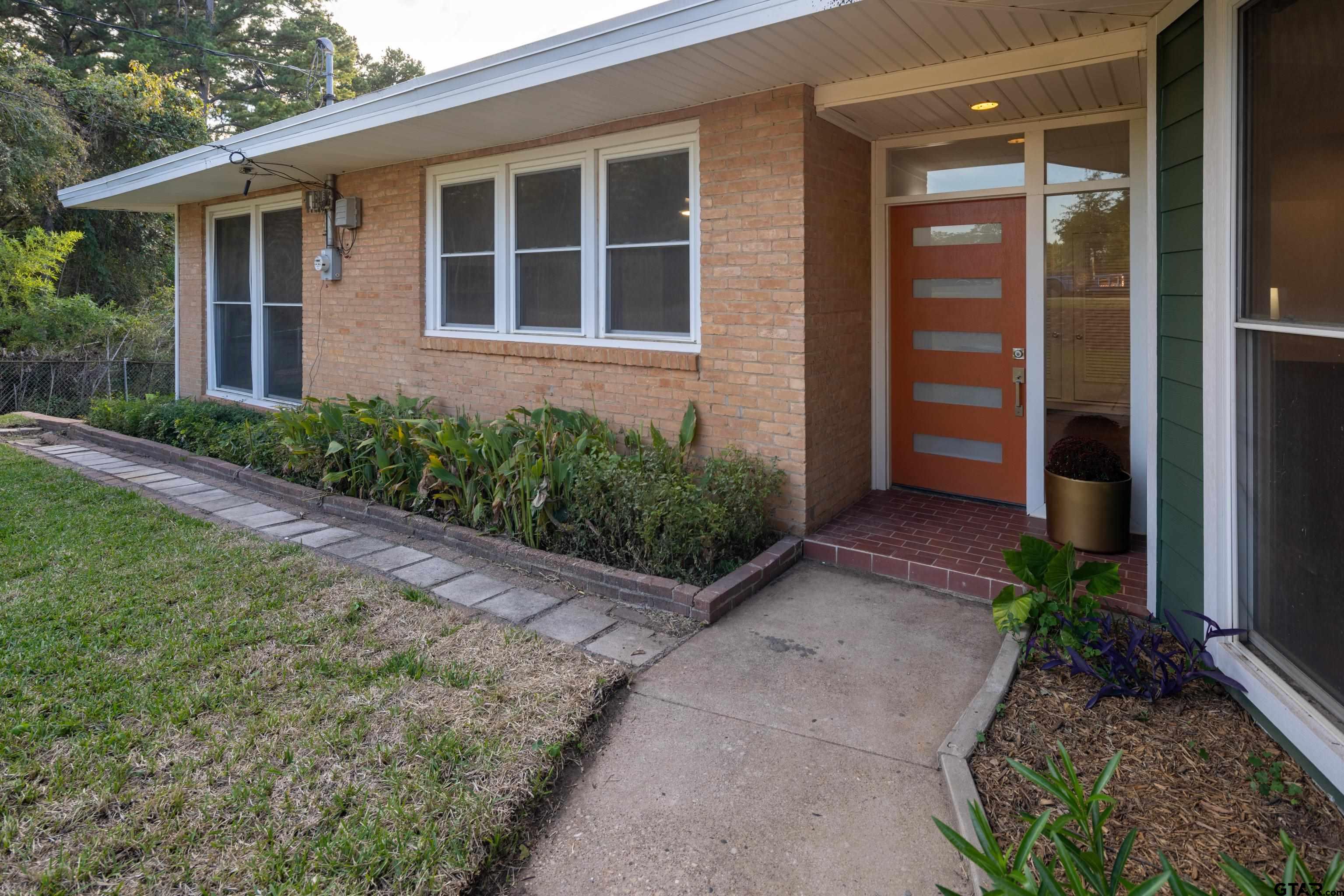 1715 Ridgeview Drive Tyler, TX 75701 - Photo 2 of 35 a front view of a house with garden