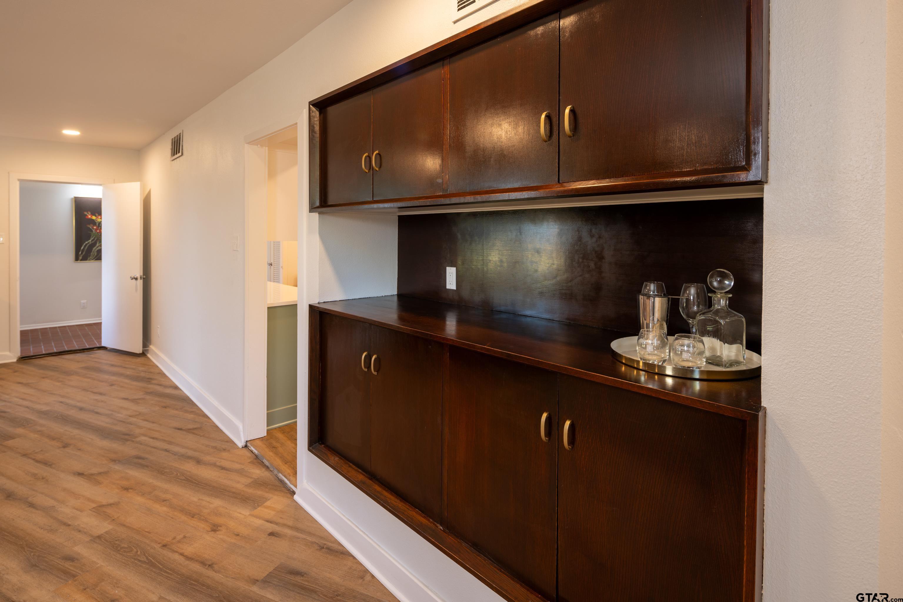 1715 Ridgeview Drive Tyler, TX 75701 - Photo 8 of 35 a close view of kitchen island with wooden floor