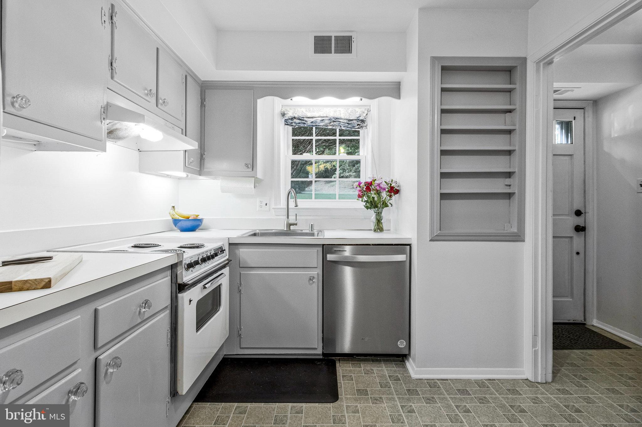 6513 Orono Court Springfield, VA 22152 - Photo 12 of 45 a kitchen with a sink stove and refrigerator
