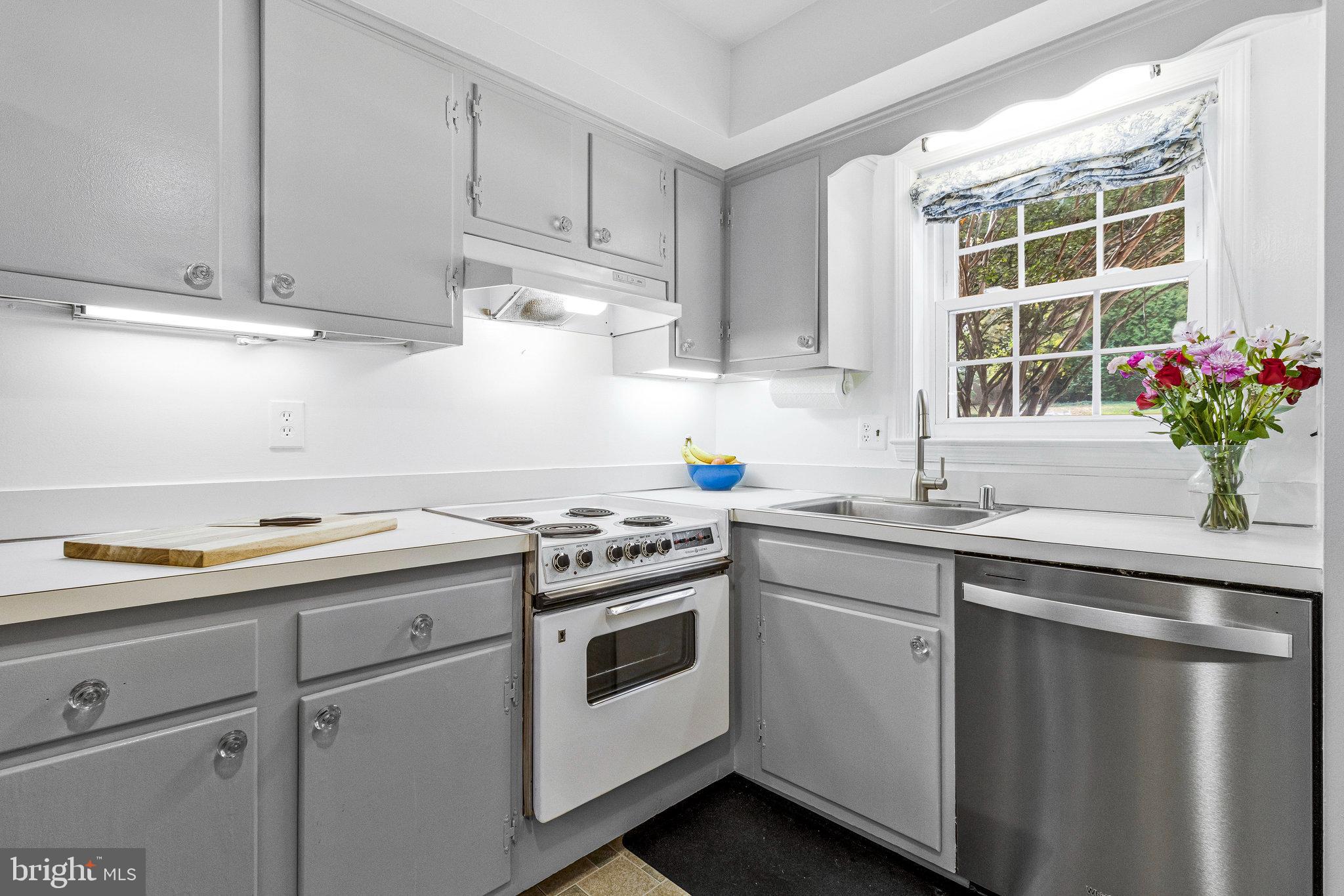 6513 Orono Court Springfield, VA 22152 - Photo 13 of 45 a kitchen with a sink stove and window