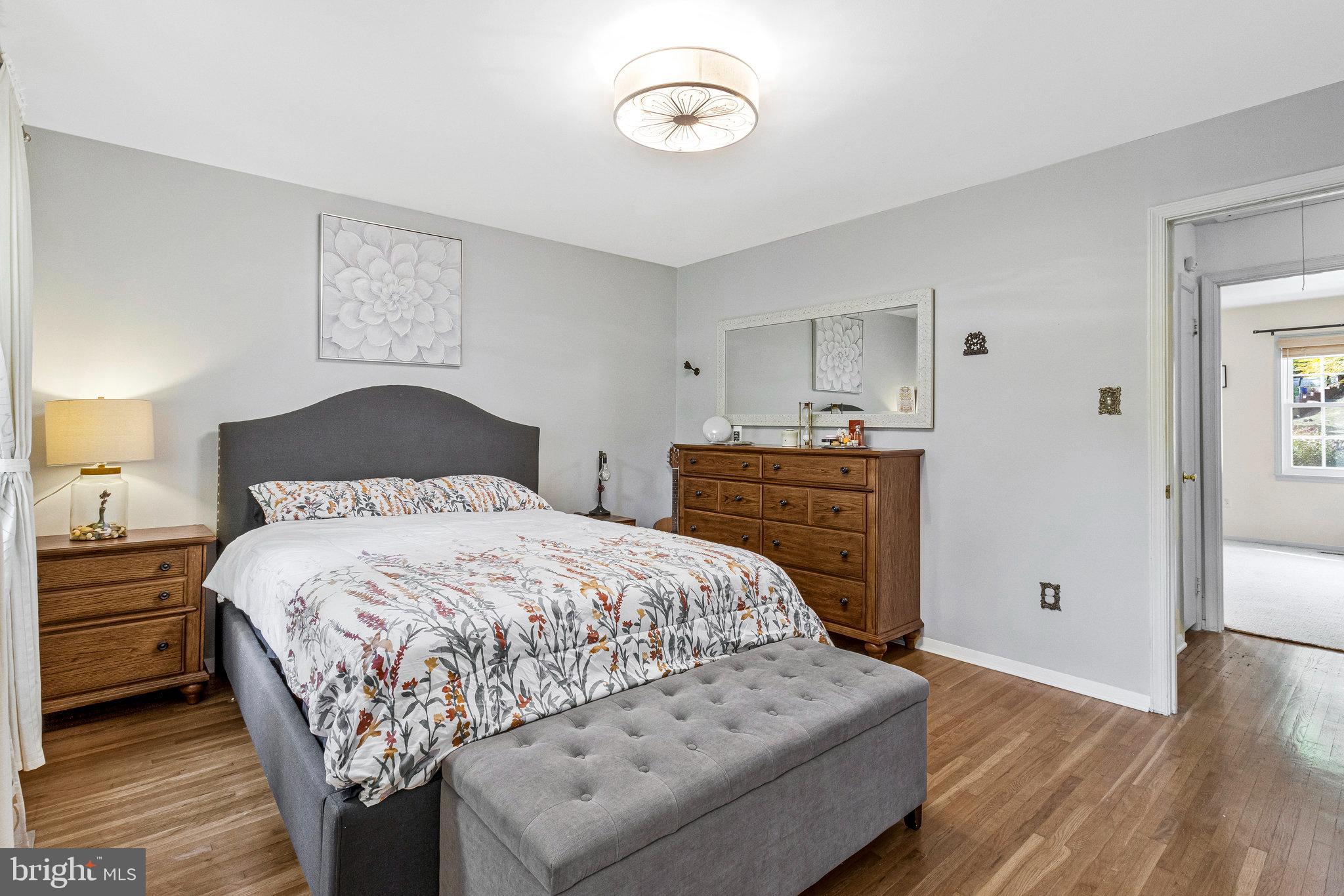 6513 Orono Court Springfield, VA 22152 - Photo 19 of 45 a bedroom with a bed and a dresser