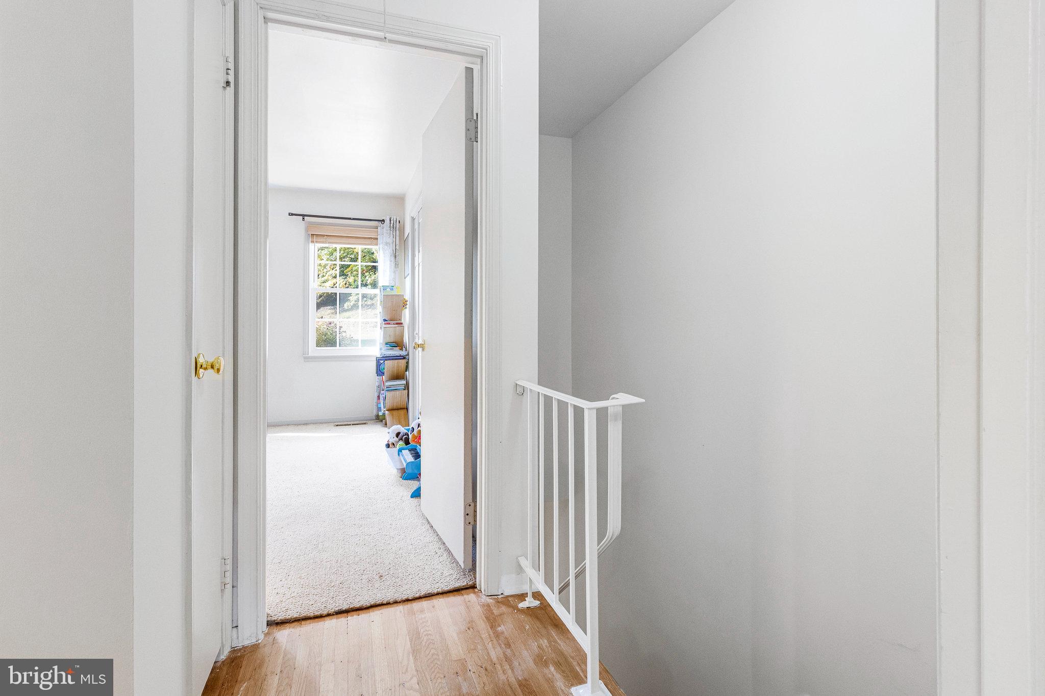 6513 Orono Court Springfield, VA 22152 - Photo 23 of 45 a view of a hallway with wooden floor and entryway