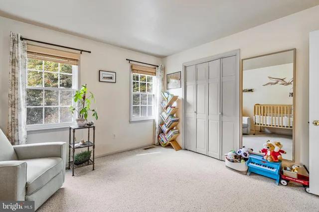 a view of a livingroom with furniture and a window