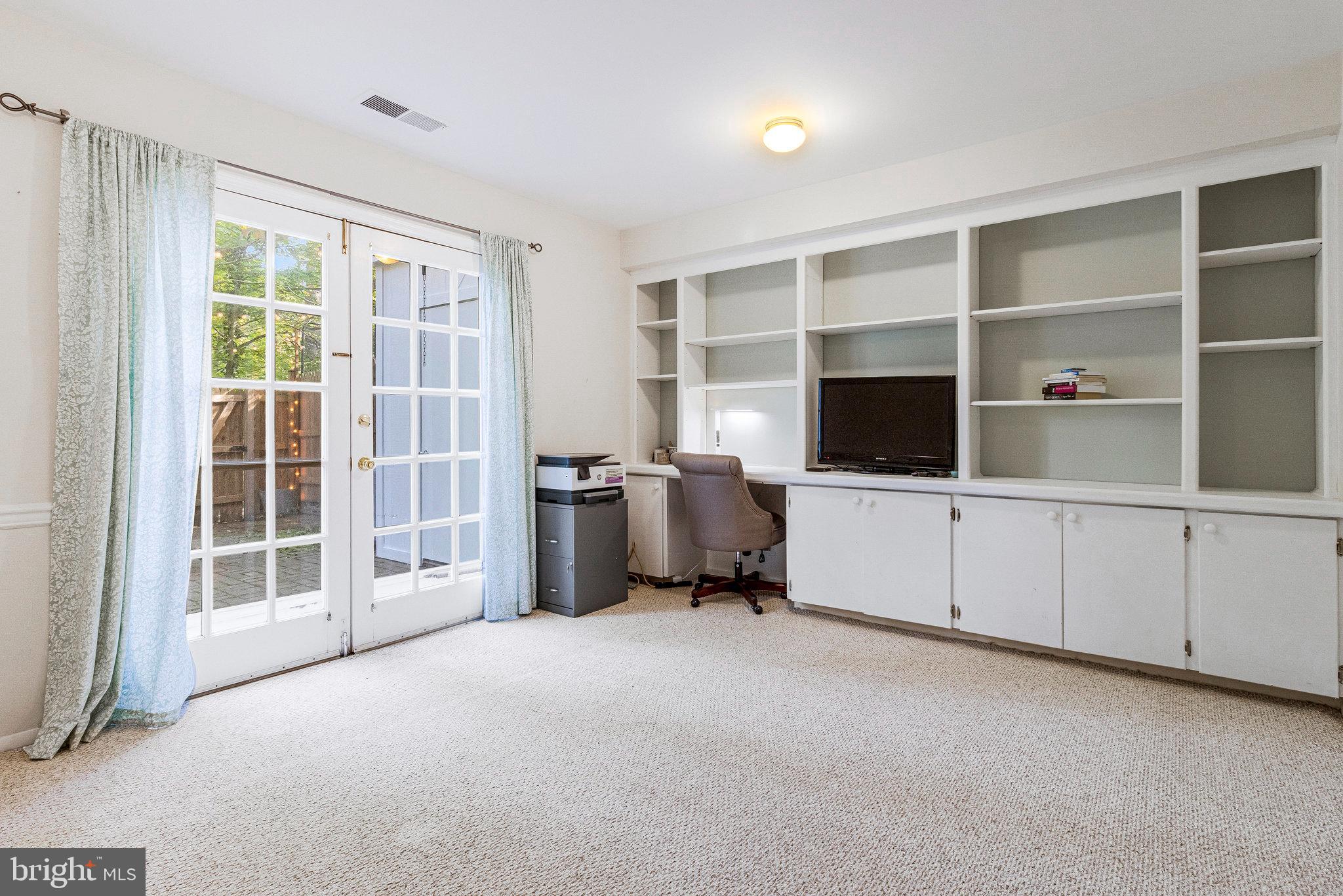 6513 Orono Court Springfield, VA 22152 - Photo 29 of 45 a view of a bedroom with workspace and windows