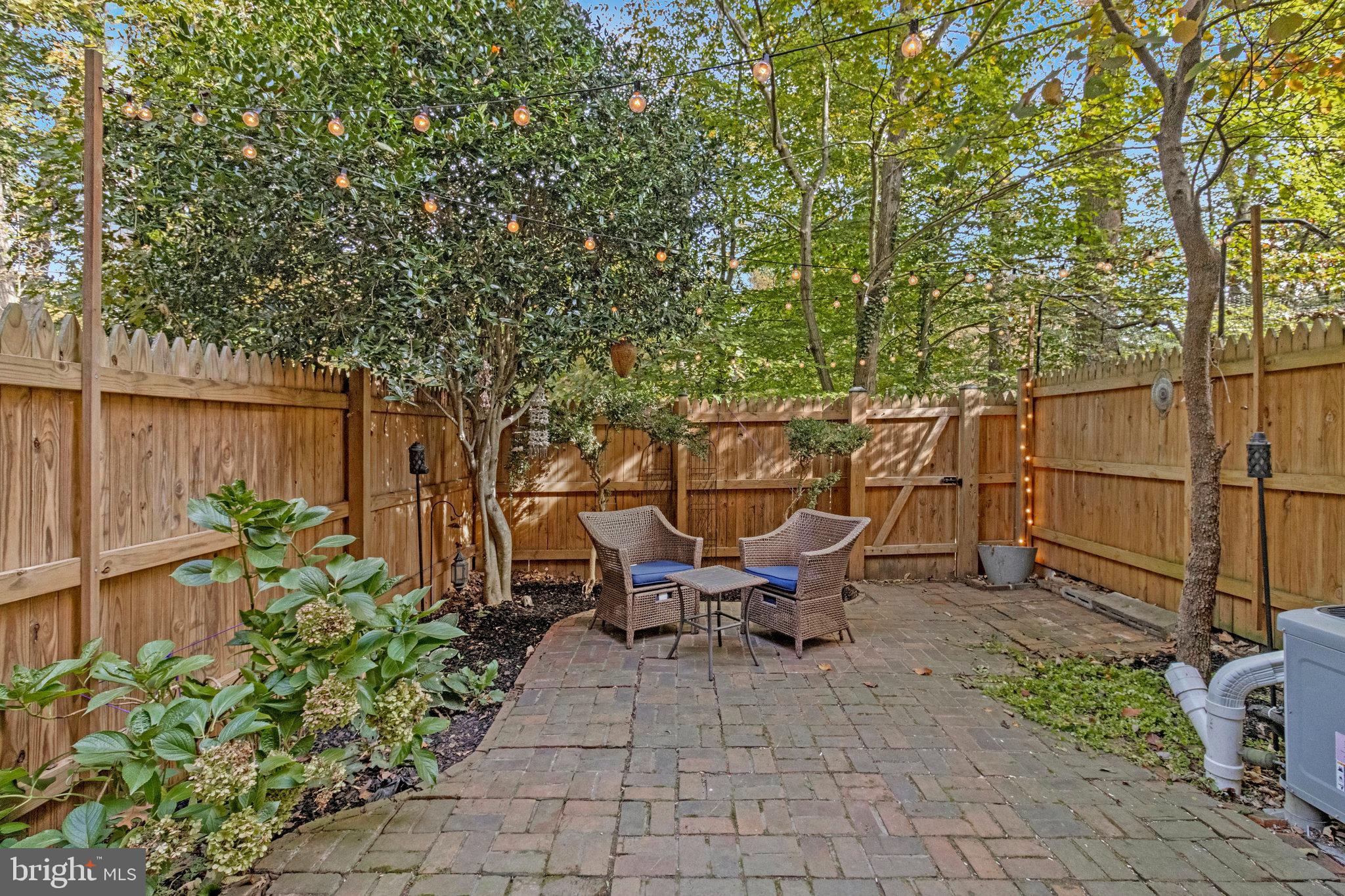 6513 Orono Court Springfield, VA 22152 - Photo 37 of 45 a backyard of a house with table and chairs