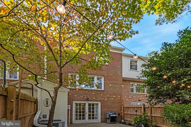 front view of a house with a tree