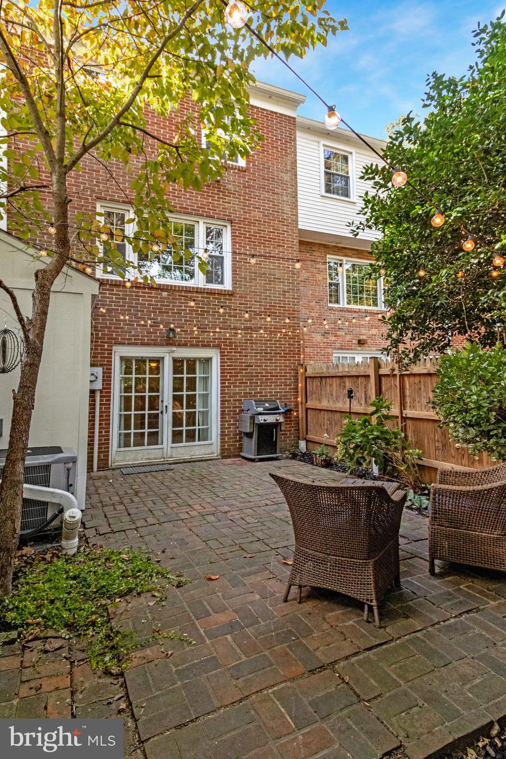 6513 Orono Court Springfield, VA 22152 - Photo 40 of 45 a backyard of a house with barbeque oven and outdoor seating