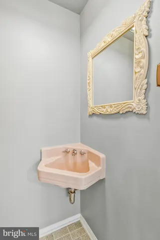 a bathroom with a sink and mirror