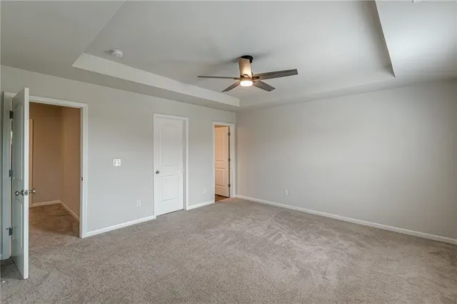a view of room with a ceiling fan
