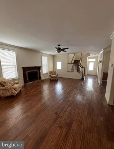 a kitchen with a sink a stove top oven and cabinets