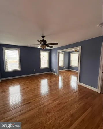 a view of an entryway with wooden floor