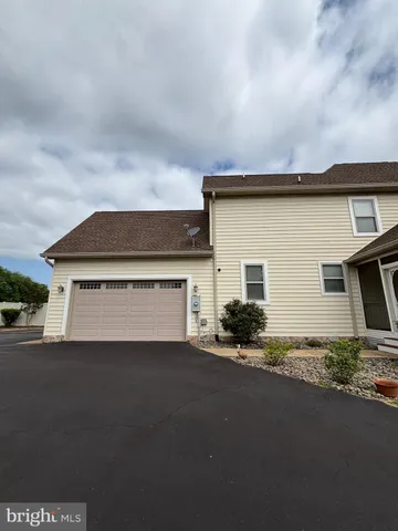a view of a backyard of the house