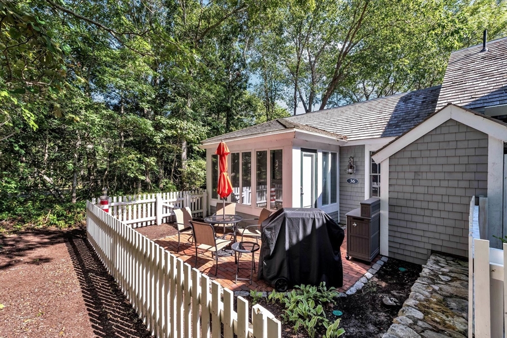 36 Brant Rock Road, Unit 821 Mashpee, MA 02649 - Photo 18 of 23 a view of house with patio outdoor seating
