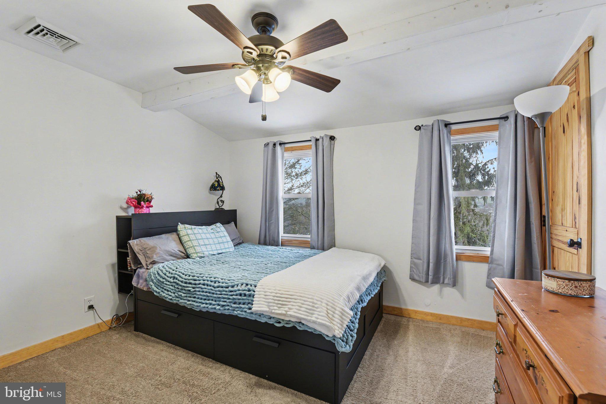 1117 State Road Duncannon, PA 17020 - Photo 17 of 29 a bedroom with a large bed and a chandelier