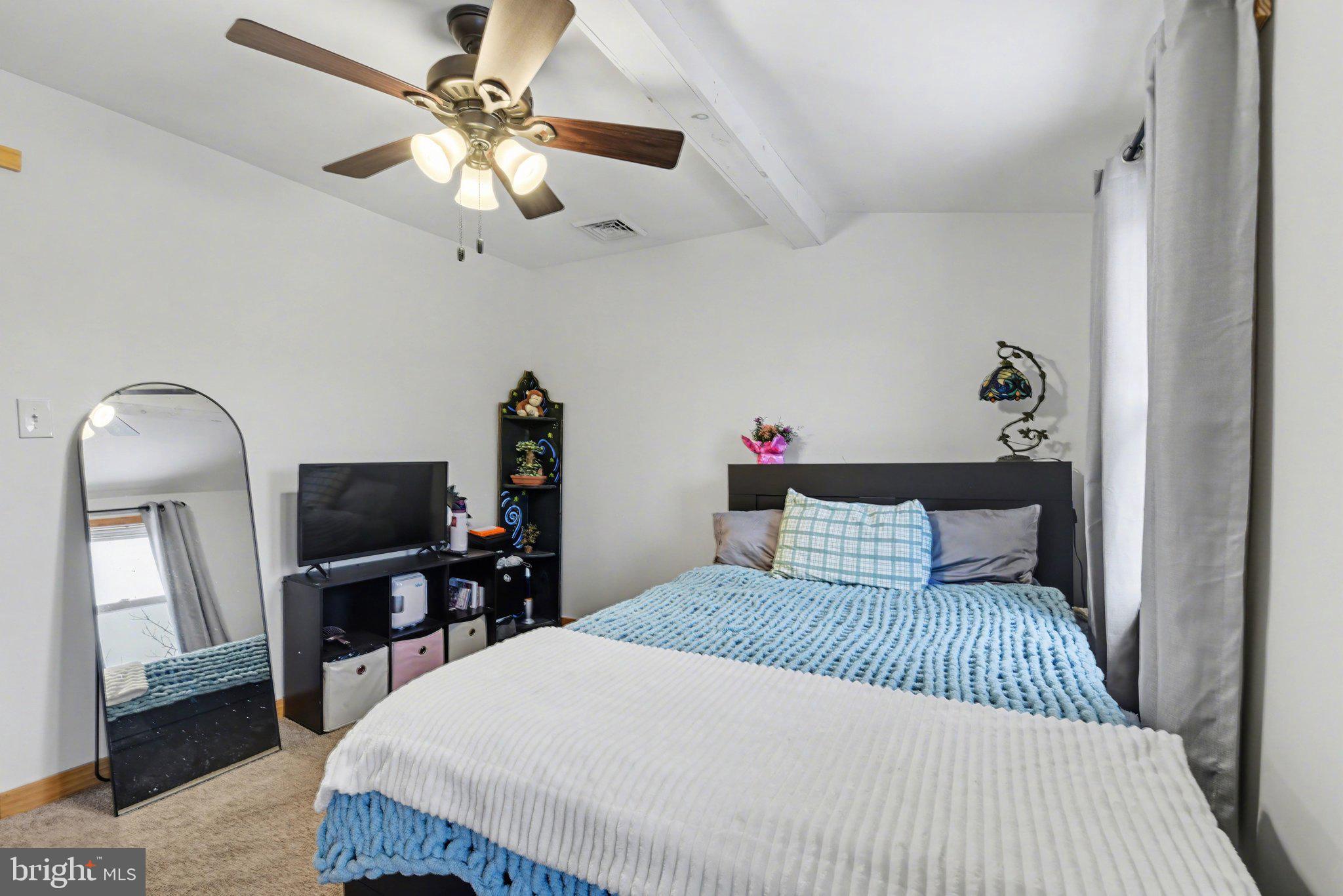 1117 State Road Duncannon, PA 17020 - Photo 18 of 29 a bedroom with a large bed and a chandelier