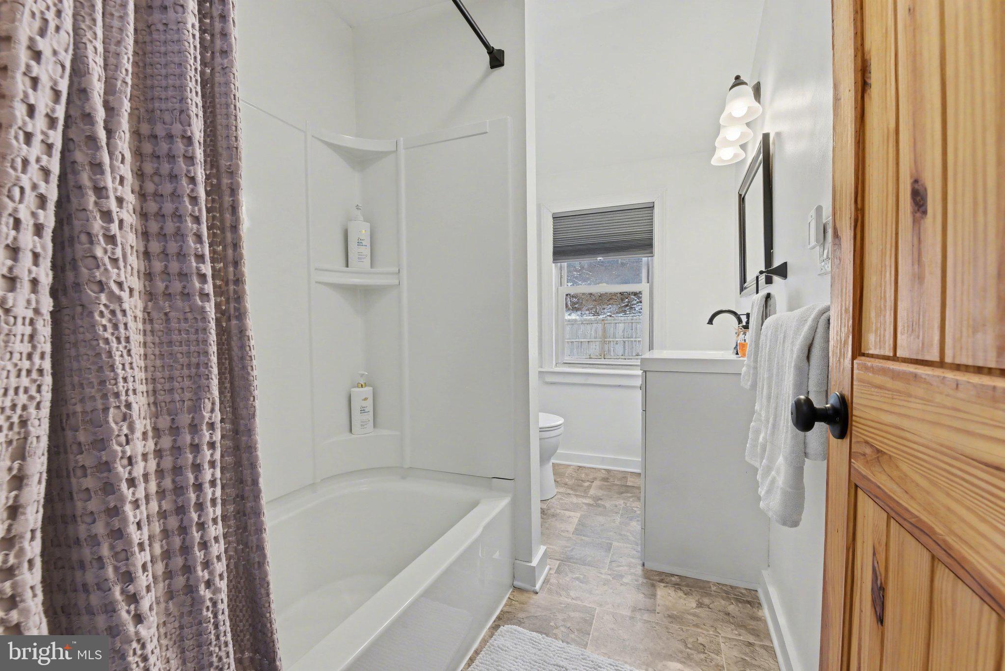 1117 State Road Duncannon, PA 17020 - Photo 21 of 29 a bathroom with a tub sink and mirror
