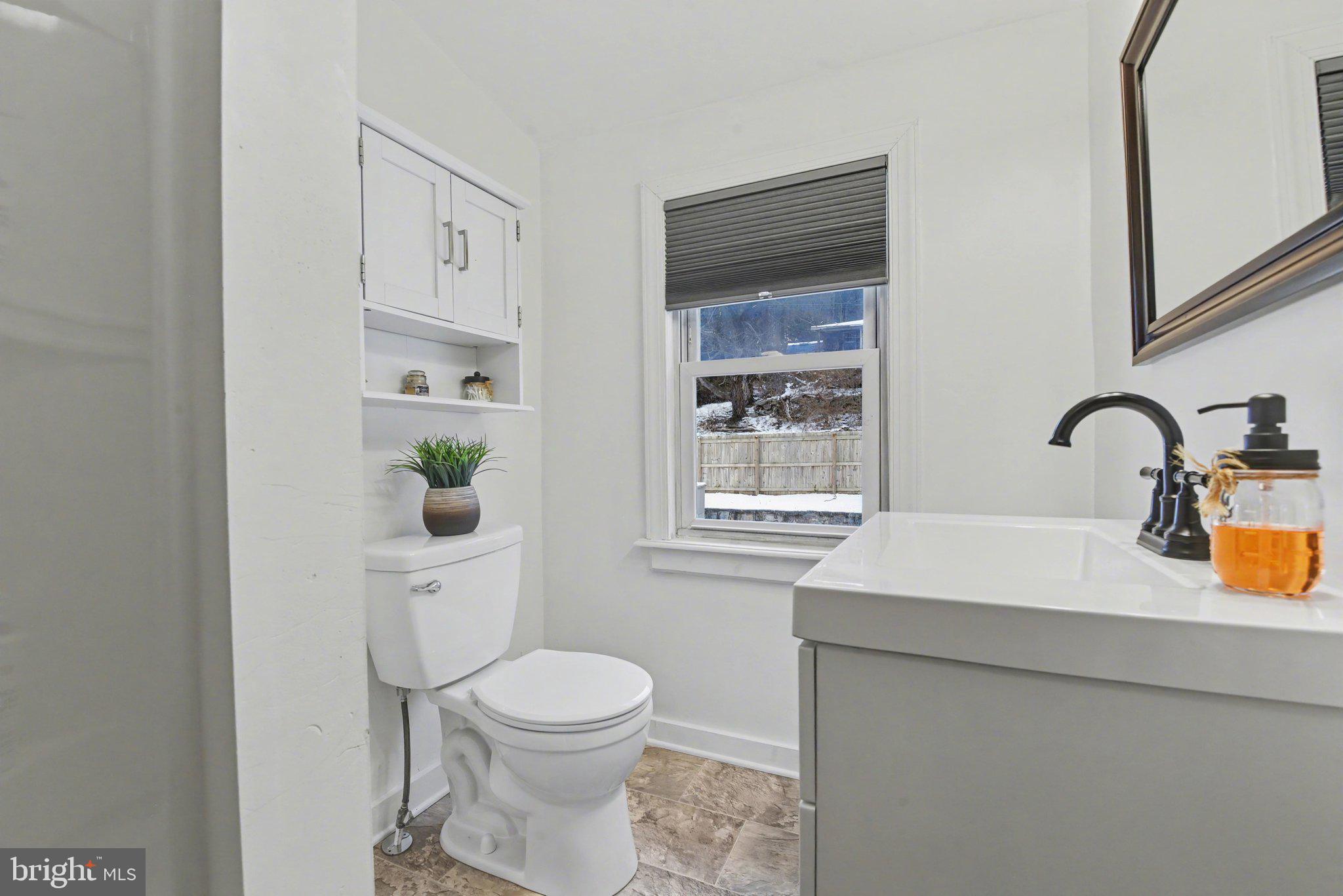 1117 State Road Duncannon, PA 17020 - Photo 22 of 29 a bathroom with a toilet sink and mirror