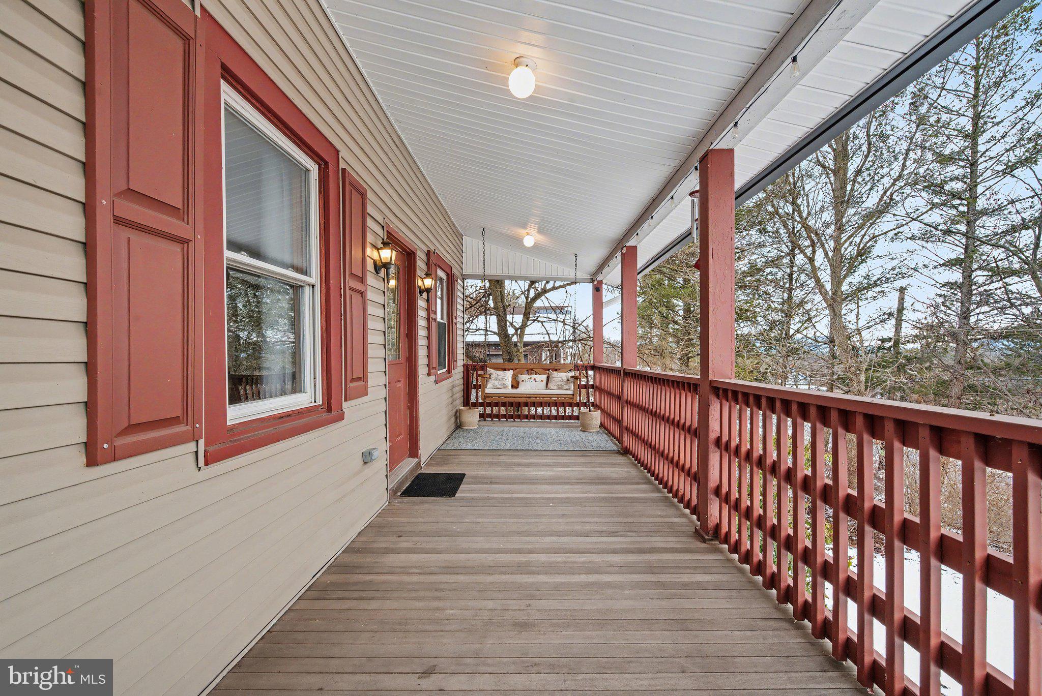 1117 State Road Duncannon, PA 17020 - Photo 3 of 29 a view of a porch with wooden floor and stairs